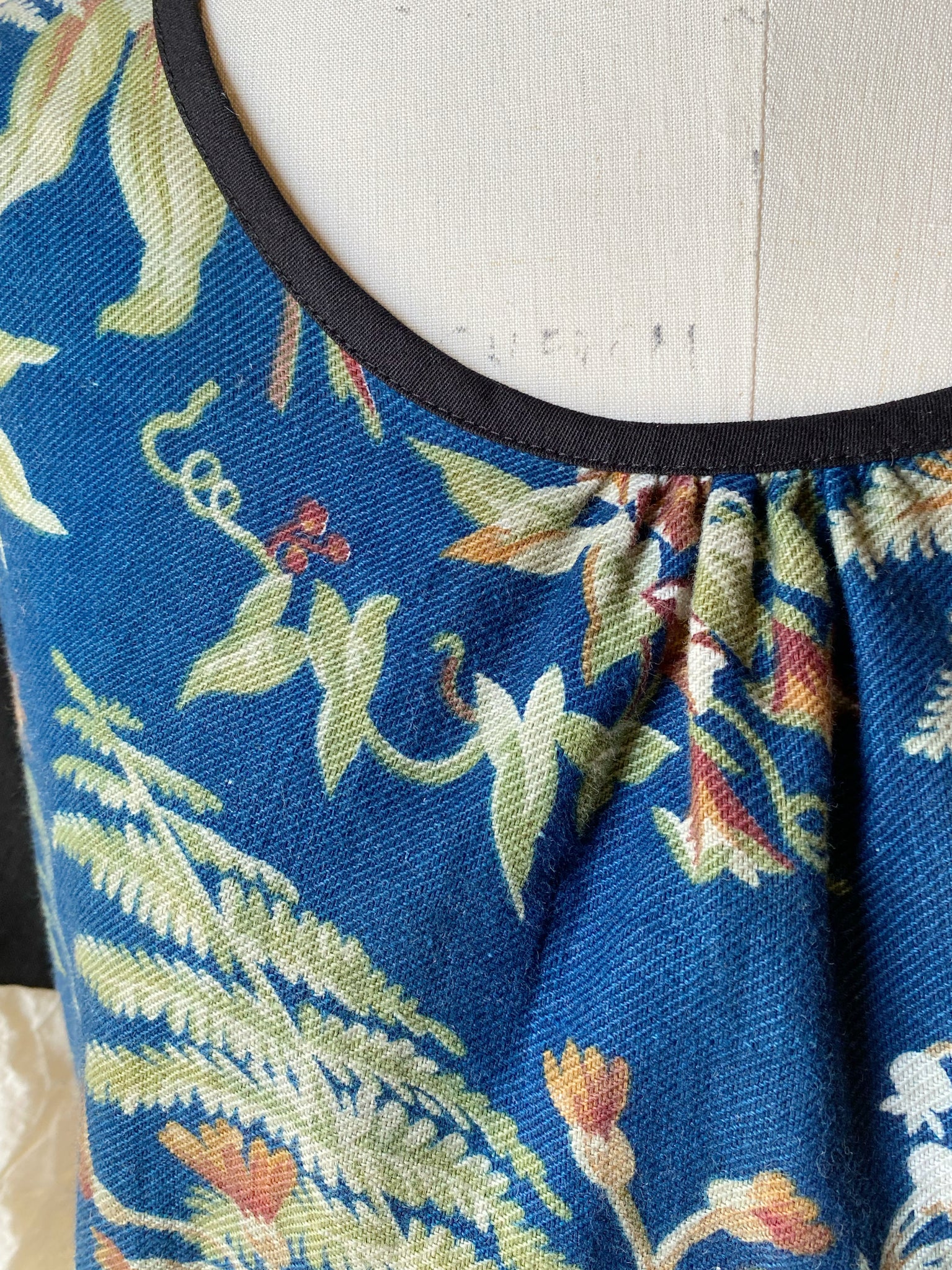 blue ground antique floral twill tie dress