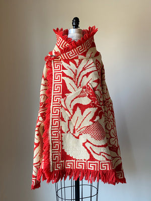 red and off white coverlet cocoon